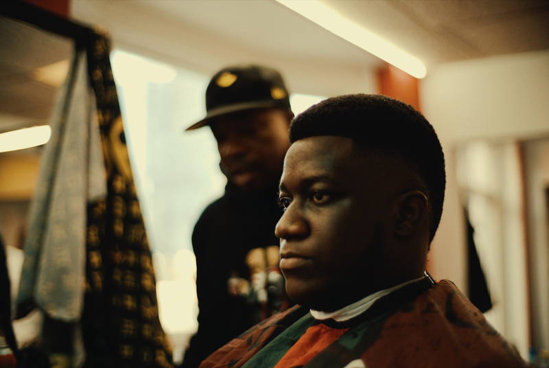 Client with a finished box fade in the chair at RDH Barbers, a Black owned barbershop in Toronto